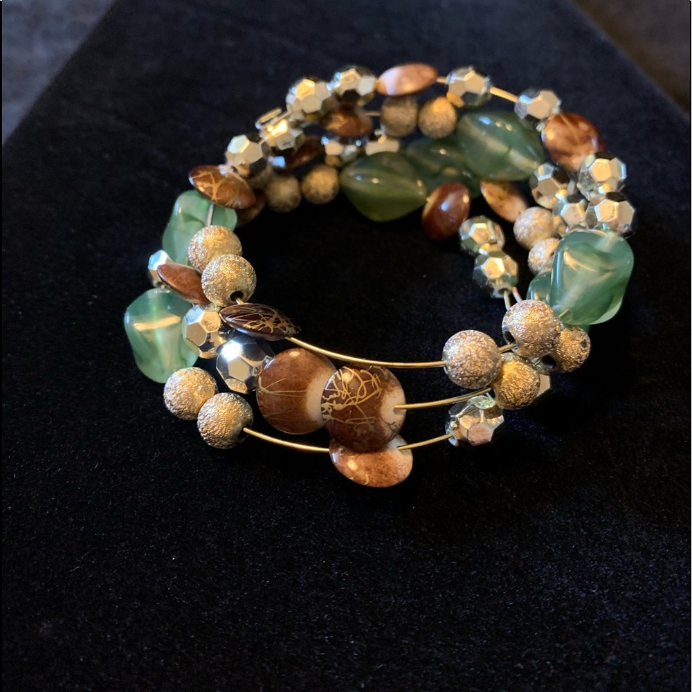 Memory wire fidget bracelet. Gold, sea green, brown assorted shaped beads.